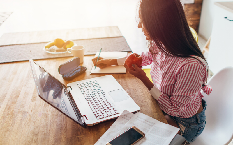 woman working on budget after financial setback